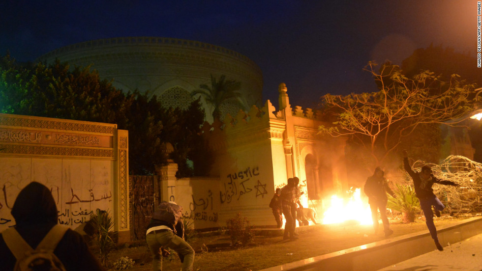 The entrance of Egypt&#39;s presidential palace in Cairo is in flames February 1, as protesters battle security forces.