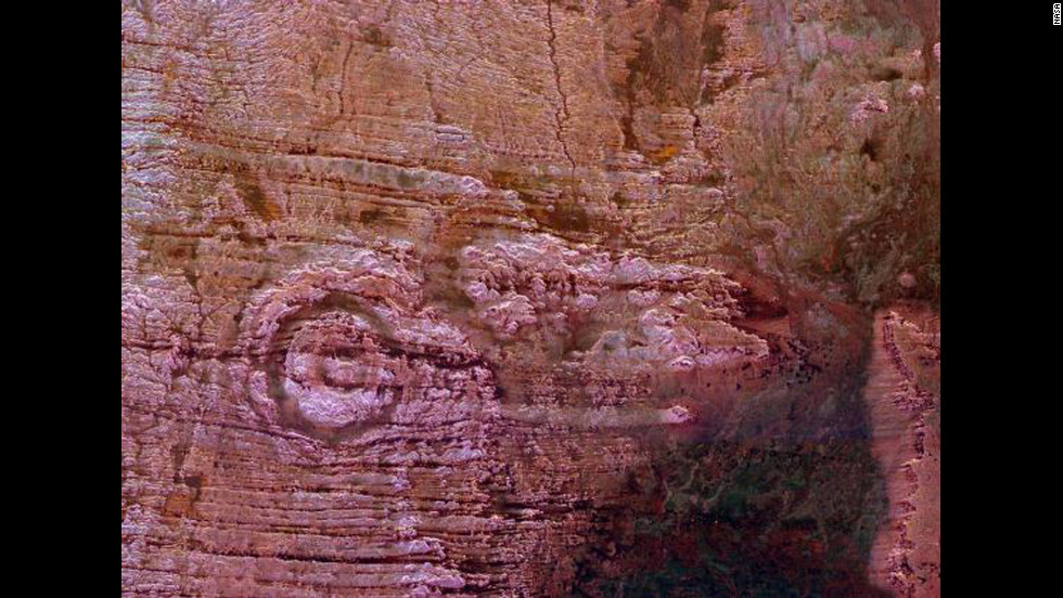 NASA scientists say the impact of an asteroid or comet several hundred million years ago created the Aorounga crater in the Sahara Desert of northern Chad. The crater has a diameter of about 10.5 miles (17 kilometers). This image was taken by the Space Shuttle Endeavour in 1994.