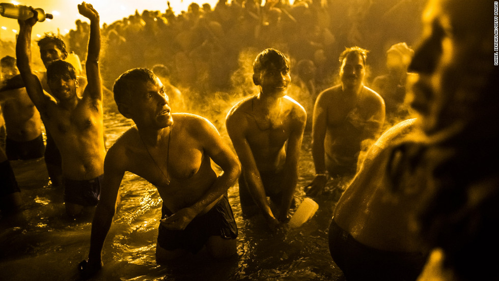 Devotees bathe in the waters of the Ganges.