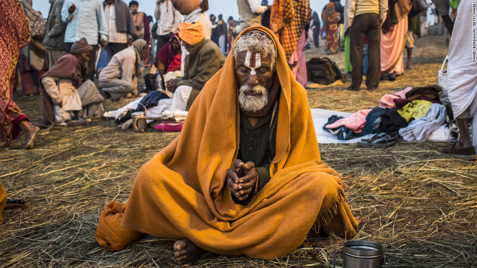 A Sadhu prays as he sits on the banks of Sangam.