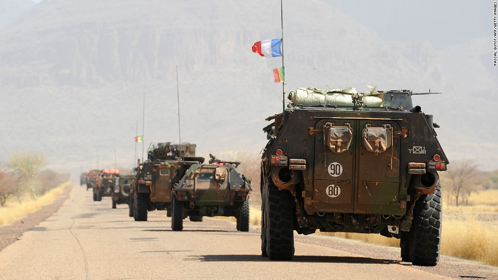 A convoy of French army vehicles head toward Gao on February 7. France is mulling over when to hand off its four-week-old intervention to U.N. peacekeepers. 