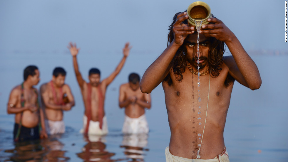 Hindu devotees pray as they bathe in the Sangam -- the confluence of the Yamuna, Ganges and mythical Saraswati rivers -- at the Kumbh Mela in Allahabad, India, on Sunday, February 10.