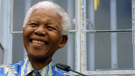 Former South African President Nelson Mandela spoke in front of his former prison cell on Robben Island in November 2003.