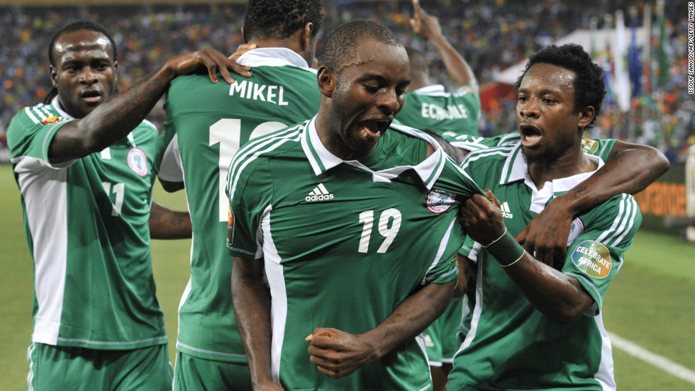 Sunday Mba (center) celebrates with his Nigeria teammates after scoring the only goal of the final against Burkina Faso.