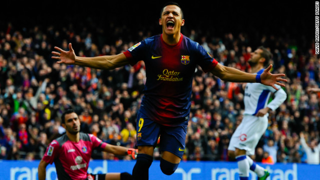 Alexis Sanchez celebrates after scoring Barcelona&#39;s opening goal against Getafe on Sunday.
