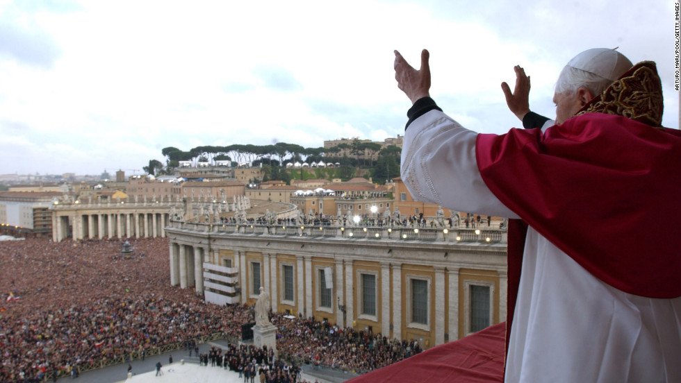 Newly elected as pope, Benedict XVI gestures to the crowd in St. Peter&#39;s Square in Vatican City on April 19, 2005. 