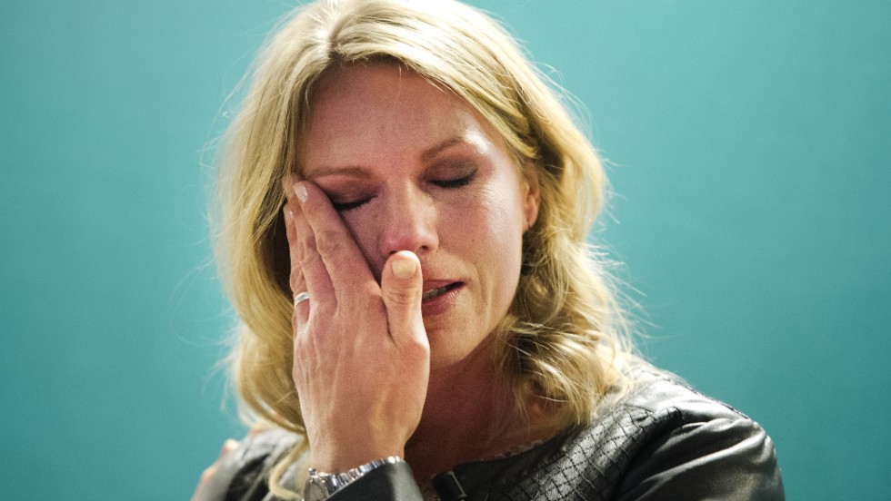 Esther Vergeer wipes away a tear after announcing her retirement from wheelchair tennis at a press conference in Rotterdam, where she is a director of an able-bodied men&#39;s tournament. 