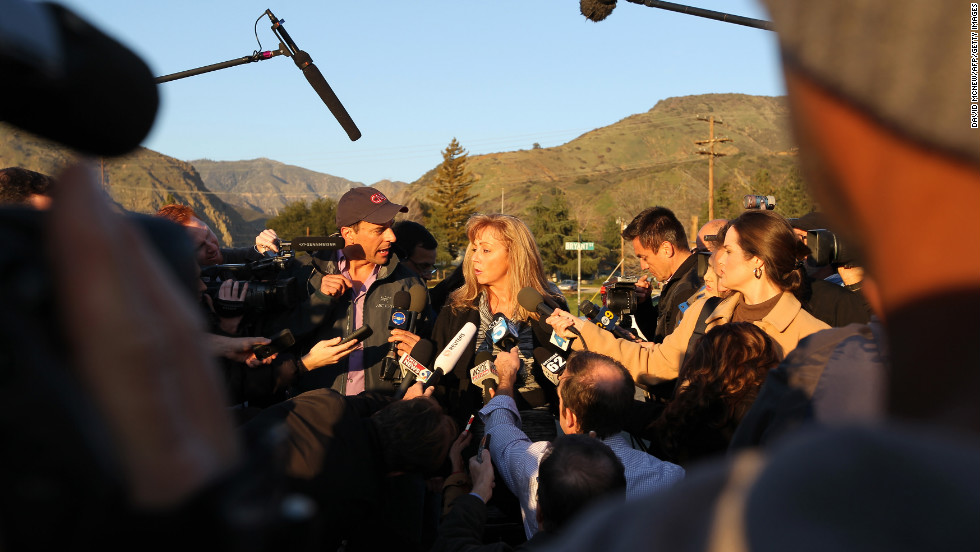 Cindy Bachman, information officers for the San Bernardino County Sheriff&#39;s Department, speaks to reporters at a roadblock near Big Bear Lake, California, on Tuesday, February 12. Christopher Jordan Dorner has been the subject of a massive manhunt and is accused of killing one police officer and wounding two others, as well as killing the daughter of his police union representative and her fiance on Sunday.