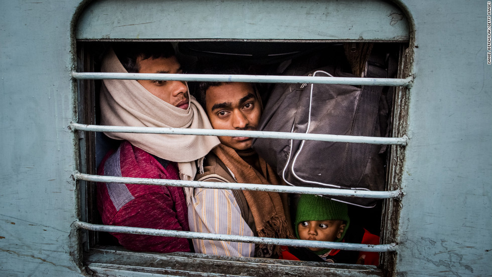 Hindu pilgrims pack tightly into a train car at Allahabad train station on Monday, February 11, where a deadly stampede occurred the night before.