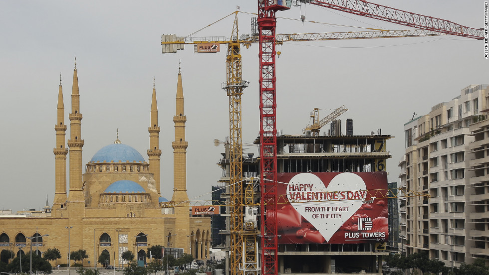A giant Valentine&#39;s Day poster hangs on a construction site near a mosque in Beirut, Lebanon.  