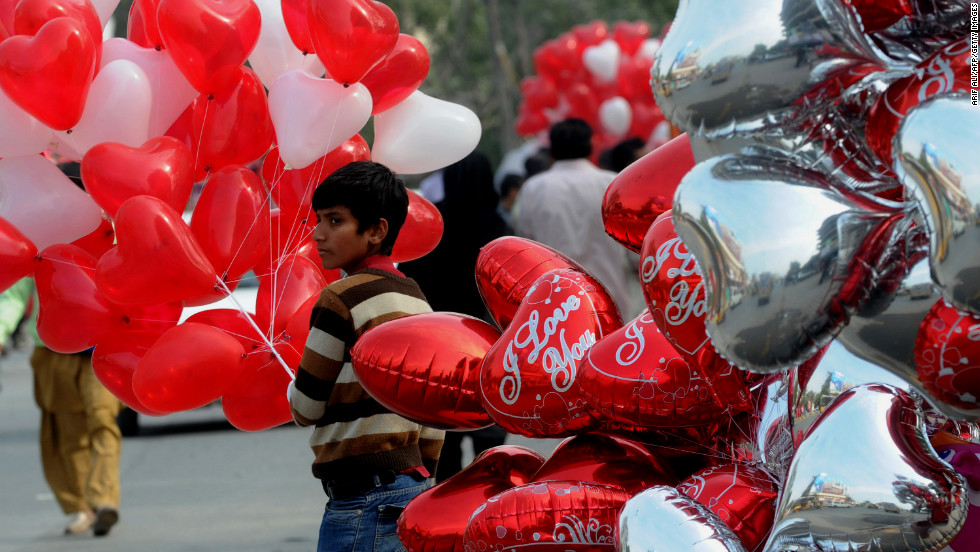 A vendor sells heart-shaped Valentine&#39;s Day balloons in Lahore, Pakistan.