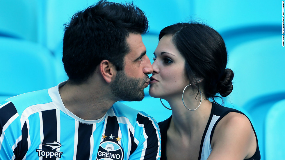 A couple kisses on Valentine&#39;s Day before the soccer match between Gremio of Brazil and Huachipato of Chile for the Libertadores Cup, in Porto Alegre, Brazil.
