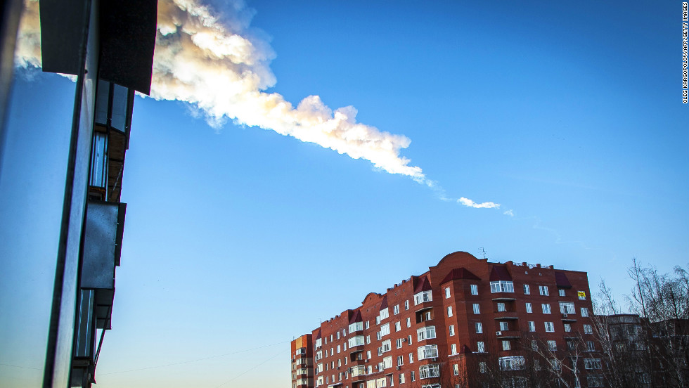 A meteor streaks through the sky before exploding with a flash and boom that shattered glass in buildings and left hundreds of people hurt.