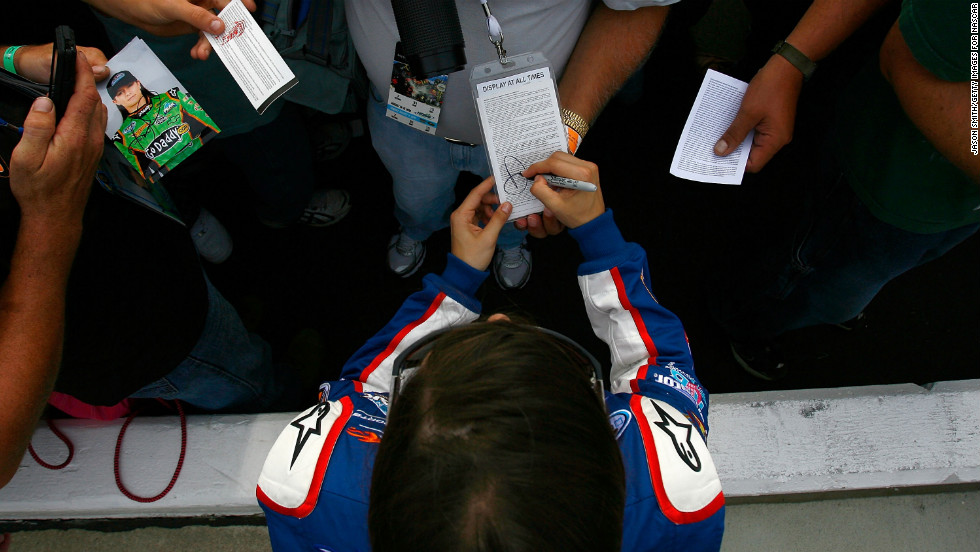 Patrick signs autographs during qualifying for the CARFAX 250 in 2010 in Brooklyn, Michigan.