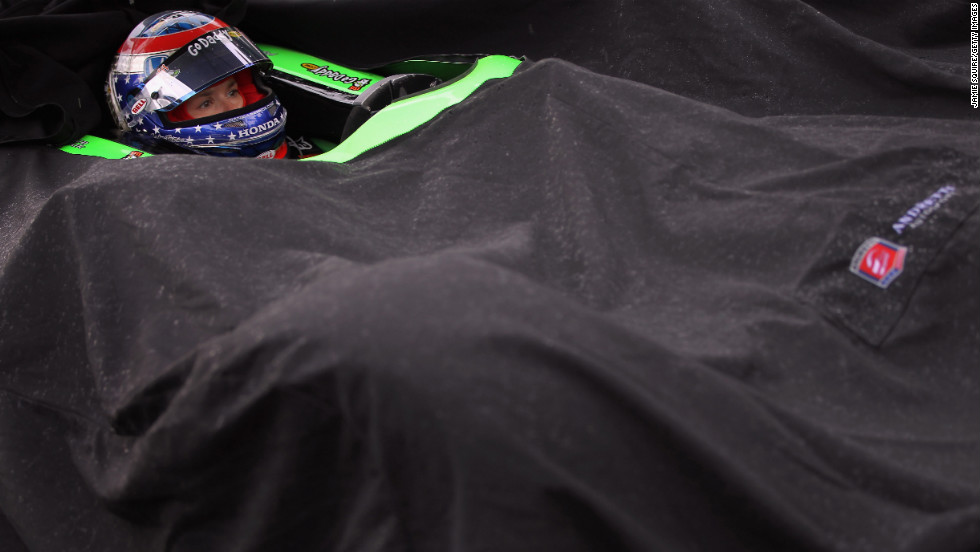 Patrick waits in the rain while her car is covered during qualifying for the Indianapolis 500 in 2011.