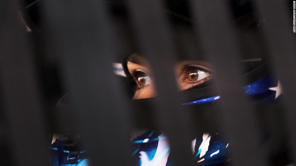 Patrick sits in her car in the garage area during practice for the VFW Sport Clips Help a Hero 200 in 2012 in Darlington, South Carolina.