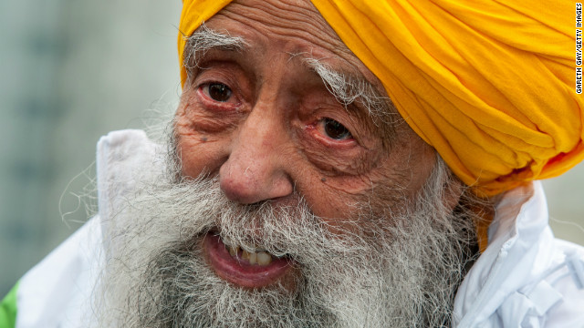 Fauja Singh smiles after completing the 10-kilometer run during the 2013 Hong Kong Marathon on Sunday.