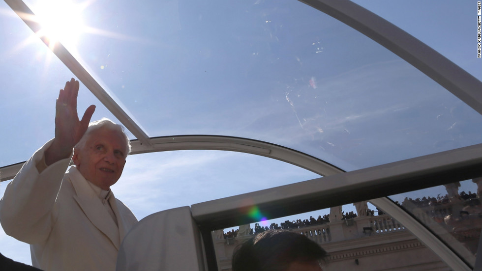 Benedict waves to the faithful. &quot;Loving the church also means having the courage to make tough choices,&quot; he said, as he called on the faithful to pray for him and the new pope.