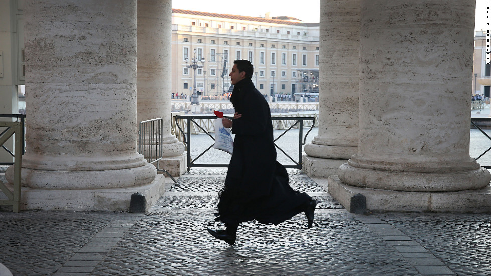 A priest runs to get into St. Peter&#39;s Square ahead of pope&#39;s last public audience address.