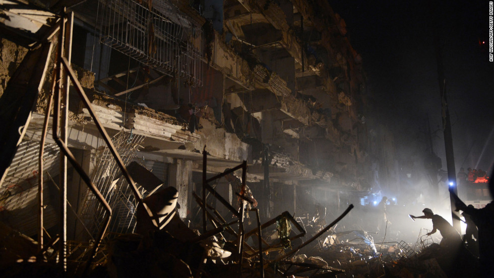 Pakistani rescuers work at the blast site.