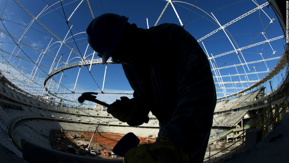 A worker swings a hammer inside &#39;Arena Fonte Nova&#39; stadium in Salvador de Bahia, Brazil on December 6, 2012 before next June&#39;s eight-nation Confederations Cup.