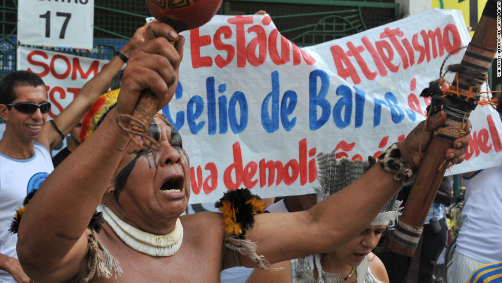 People chant slogans during a protest against the demolition of the Celio de Barros track and field stadium in Rio de Janeiro, Brazil on January 13, 2013. The stadium needs to be demolished to carry out the Maracana stadium construction plans ahead of the 2013 FIFA Confederations Cup, 2014 FIFA World Cup and 2016 Olympic games.
