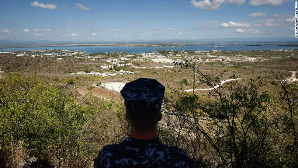 A Navy sailor surveys the base in October 2009. In December 2013, Congress &lt;a href=&quot;http://politicalticker.blogs.cnn.com/2013/12/26/obama-signs-budget-defense-bills-in-hawaii/&quot; target=&quot;_blank&quot;&gt;passed a defense-spending bill&lt;/a&gt; that makes it easier to transfer detainees out of the facility.