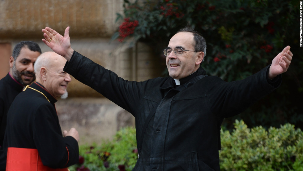 French Cardinal Philippe Barbarin greets colleagues as he arrives for a pre-conclave meeting on Saturday, March 9.