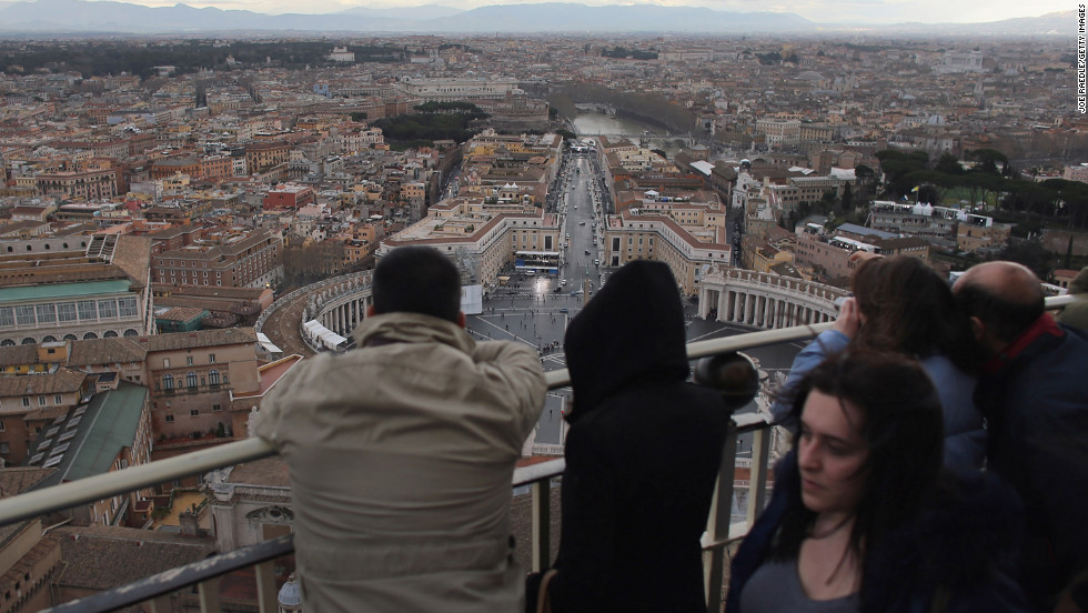Tourists take in the view from the cupola on St. Peter&#39;s Basilica on March 10.