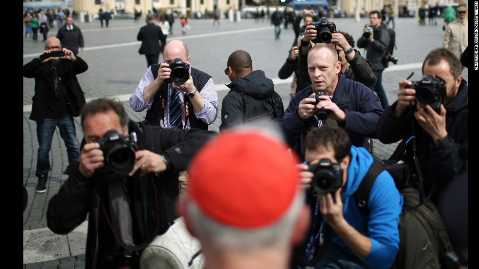 Canadian Cardinal Marc Ouellet is photographed by media as he leaves the final congregation on March 11.