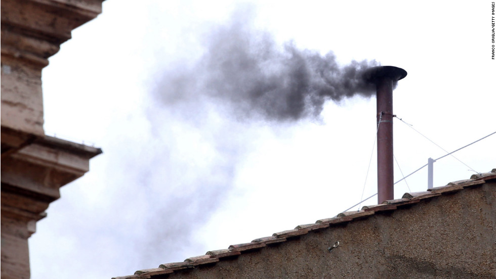 Black smoke billows from the chimney, indicating that the College of Cardinals has failed to elect a new pope on March 13. 