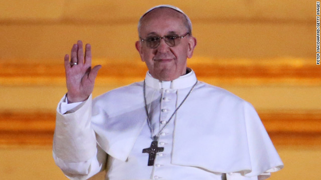 The new pope waves to cheering crowd 