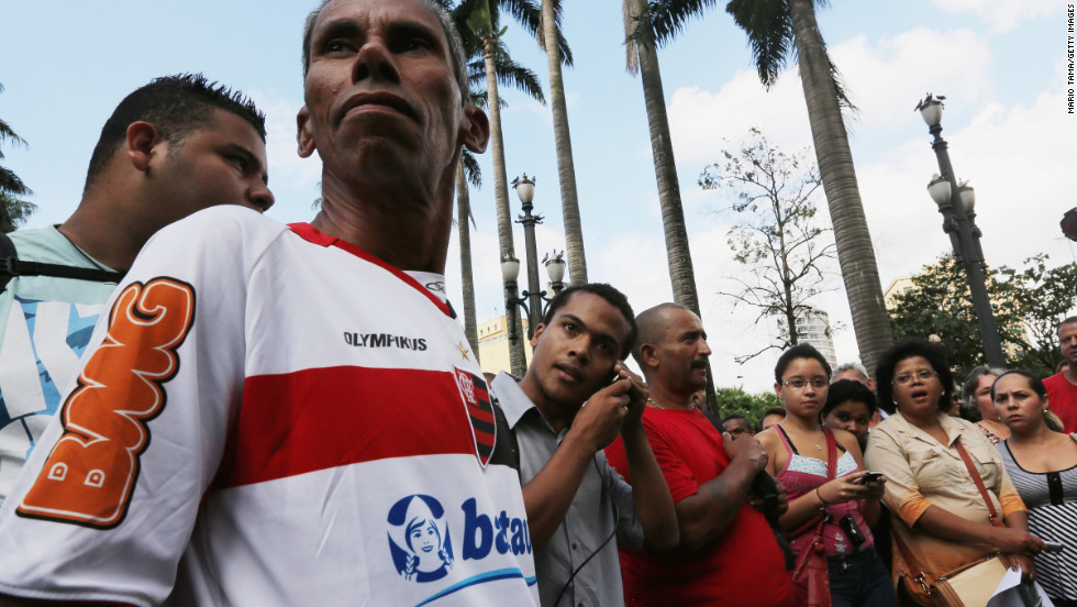 People gathered outside the Se Cathedral in in Sao Paulo listen to the announcement of the new pope on March 13.