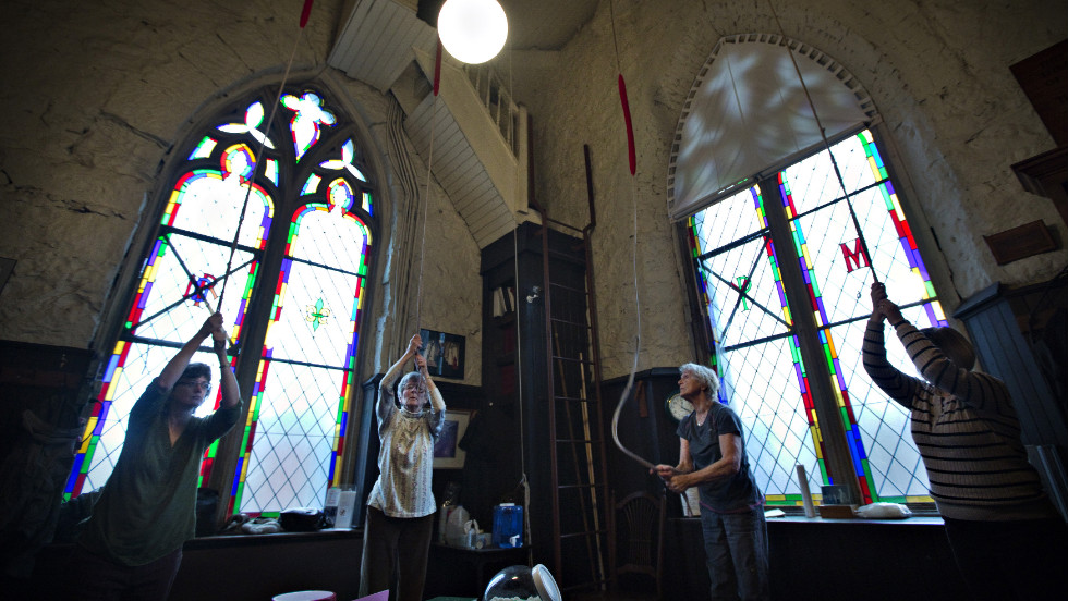 Parishioners ring the 100-year-old bells in the tower of Holy Rosary Cathedral in Vancouver in honor of the new pope.