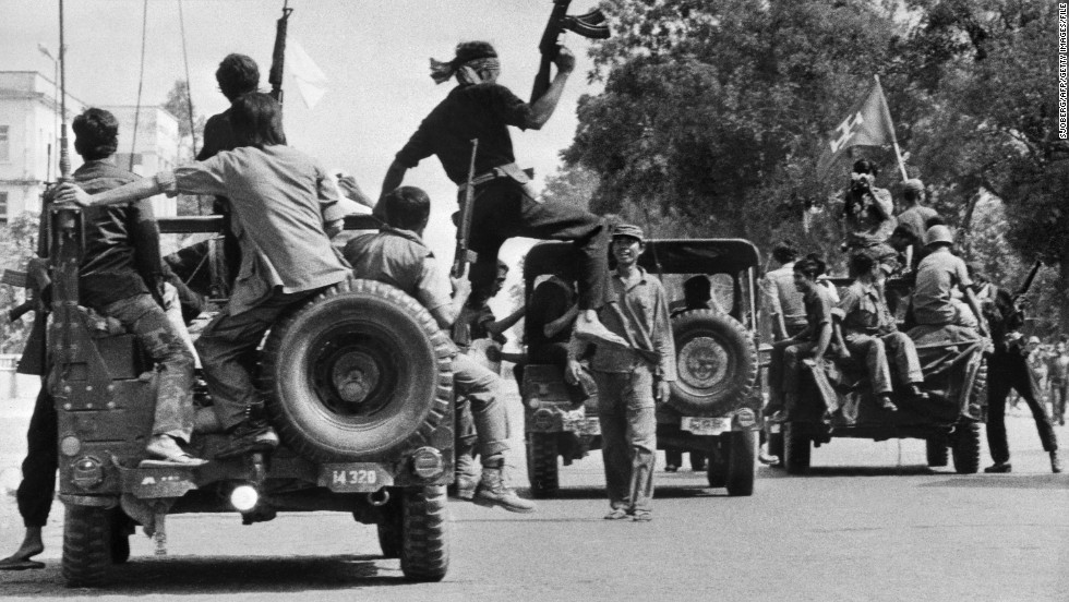Khmer Rouge guerilla soldiers wearing black uniforms drive into Phnom Penh in April 1975, as Cambodia falls under the control of the Khmer Rouge.