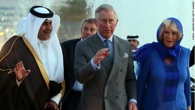 Qatar&#39;s Sheikh Abdul Rahman Bin Saud Al Thani escorts Prince Charles and his wife Camilla in Doha on Wednesday.