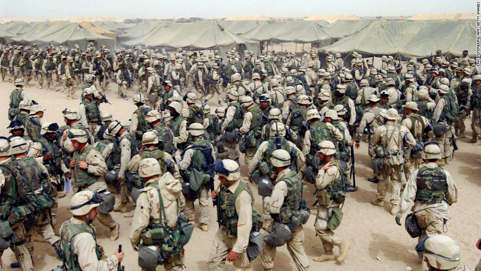 U.S. Marines in northern Kuwait gear up after receiving orders to cross the Iraqi border on March 20, 2003. It has been more than 10 years since the American-led invasion of Iraq that toppled the regime of Saddam Hussein. Look back at 100 moments from the war and the legacy it left behind.