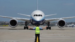 In this handout image provided by Boeing Australia, a Boeing 787 Dreamliner lands at Sydney Airport on November 15, 2011 in Sydney, Australia. The Boeing 787 Dreamliner carbon composite aircraft, was designed to reduce jet lag and air sickness and cut fuel emissions by 20%. Boeing has orders for more than 800 787 Dreamliners from more than 50 airlines around the world, including 50 for Qantas and Jetstar. The jet touched down in Sydney today to mark Qantas Airlines 92st birthday. 