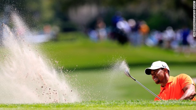 Defending champion Tiger Woods plays a bunker shot during the second round of the Arnold Palmer Invitational on Friday.