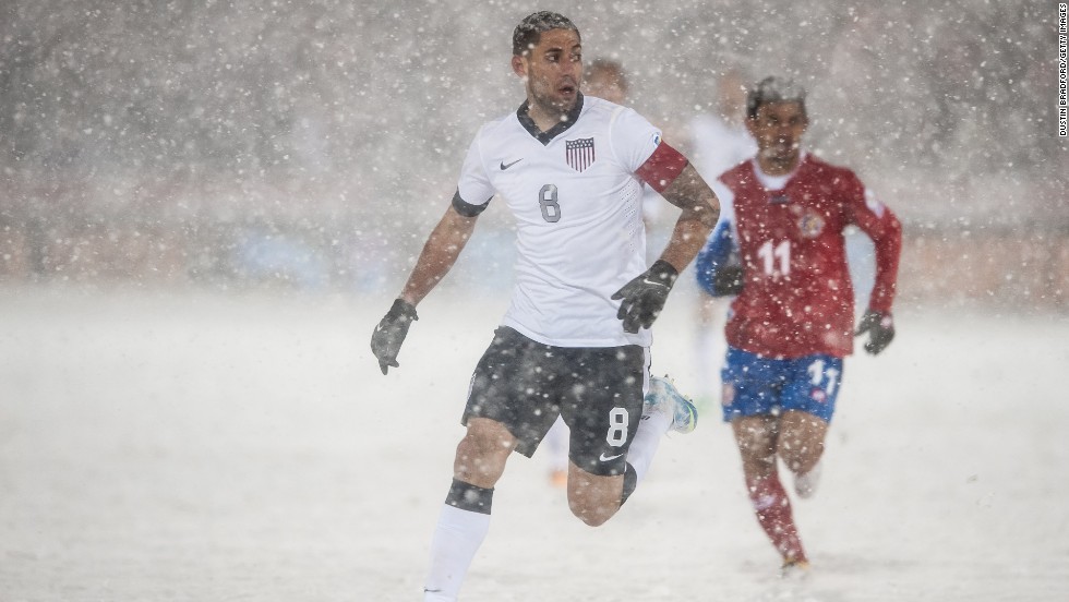 U.S. soccer player Clint Dempsey, No. 8, is surrounded by snow during a FIFA 2014 World Cup Qualifier match between Costa Rica and the United States in Commerce City, Colorado, on Friday, March 22. 