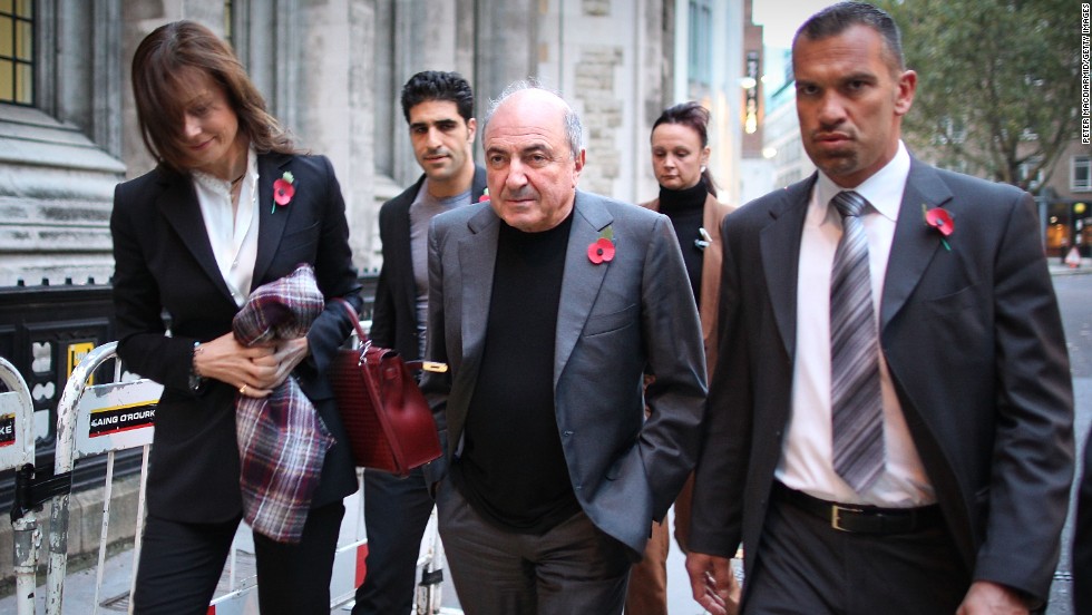 Berezovsky leaves the High Court in London with his partner Yelena Gorbunova, left, in 2011.