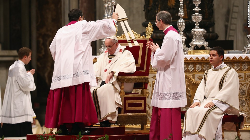 Pope Francis is crowned with his miter on Thursday.