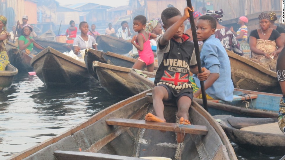 Just like any other bustling town, there&#39;s a rush hour in Makoko. Most children appear comfortable steering canoes as it is the only mode of transportation in an all-water community, but they must be careful. 