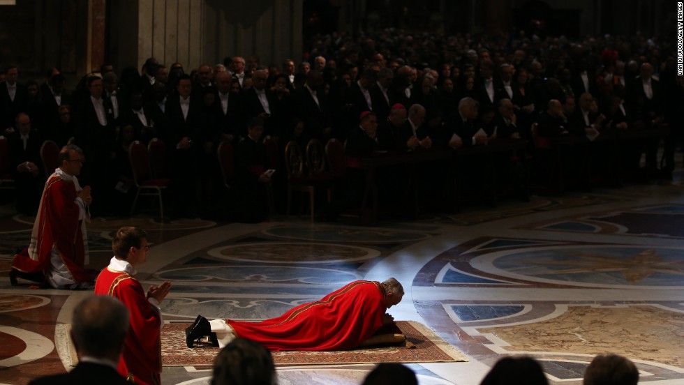 In an act of reverence, Pope Francis lies on floor of St. Peter&#39;s Basilica during Mass on Good Friday, in the Vatican.