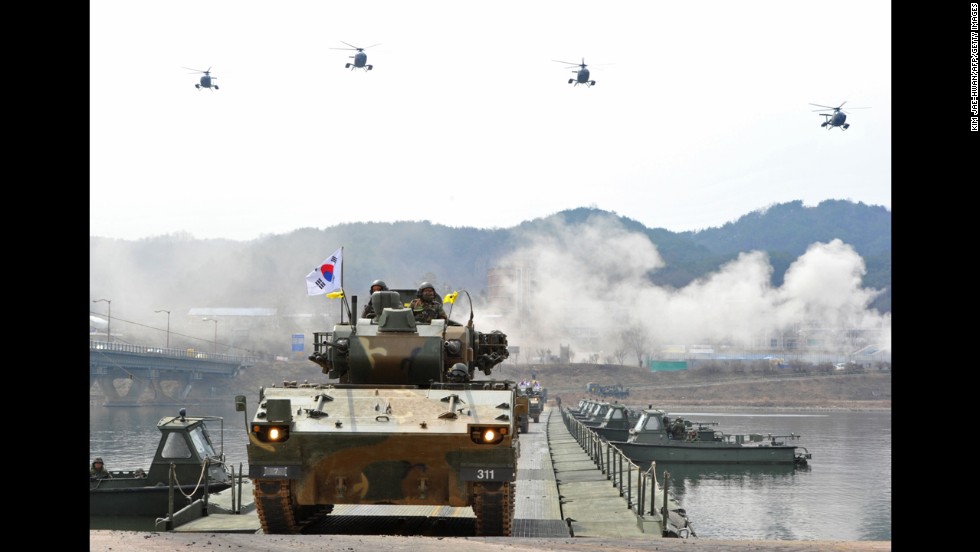 South Korean anti-aircraft armored vehicles move across a temporary bridge during a river crossing drill in Hwacheon near the North Korean border on Monday, April 1.