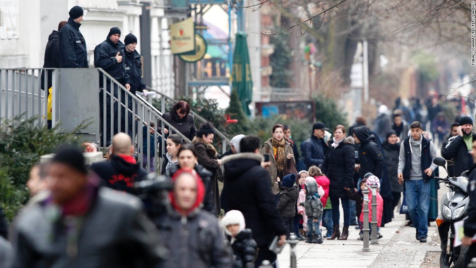 Police stand guard as residents leave their houses April 3 following the bomb&#39;s discovery. More than 800 people were evacuated before a bomb disposal crew set to work to remove the device&#39;s mechanical fuse.