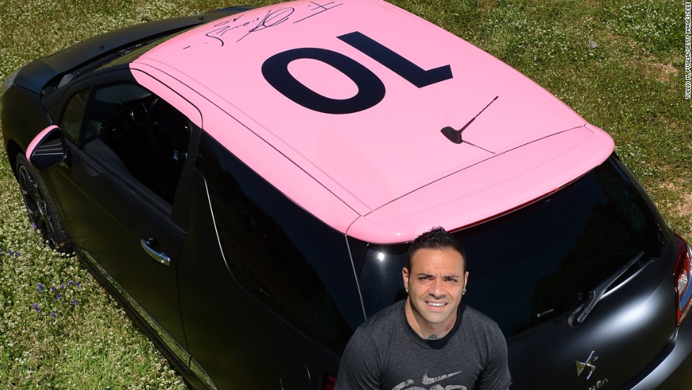 Former Palermo striker Fabrizio Miccoli poses near the Citroen DS3 which was designed for charity.