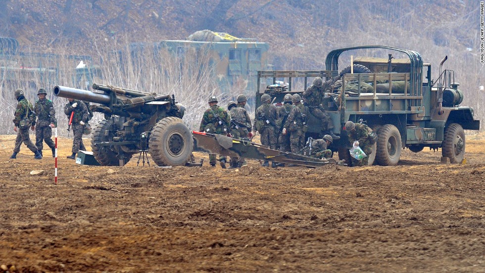 South Korean soldiers man a cannon at a military training field in Paju on April 5.