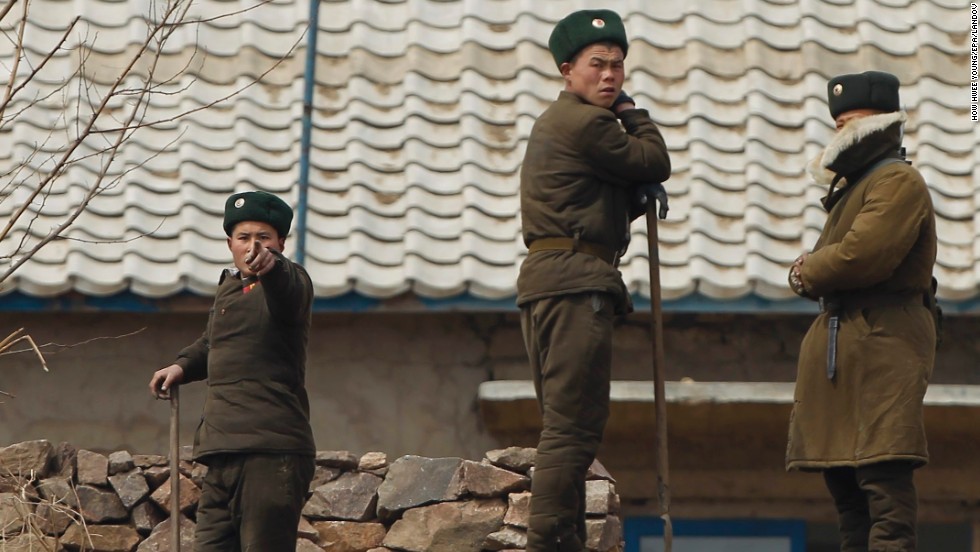 A North Korean soldier, near Sinuiju, gestures to stop photographers from taking photos in April 2013.