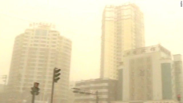 Sandstorm blurs Chinese city&#39;s skyline